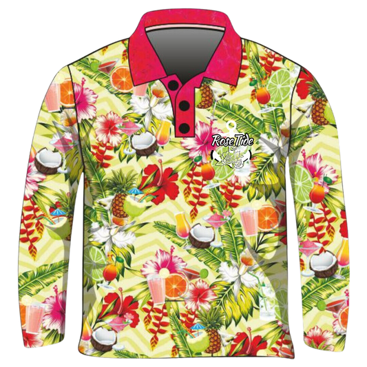 A long sleeve women's fishing shirt with a vibrant tropical theme featuring an assortment of colorful drinks, hibiscus flowers, coconuts, and various fruits. The background has a light yellow and green zigzag pattern, and the shirt has a contrasting pink collar. The "Rose Tide" logo with an anchor and floral design is displayed on the chest.