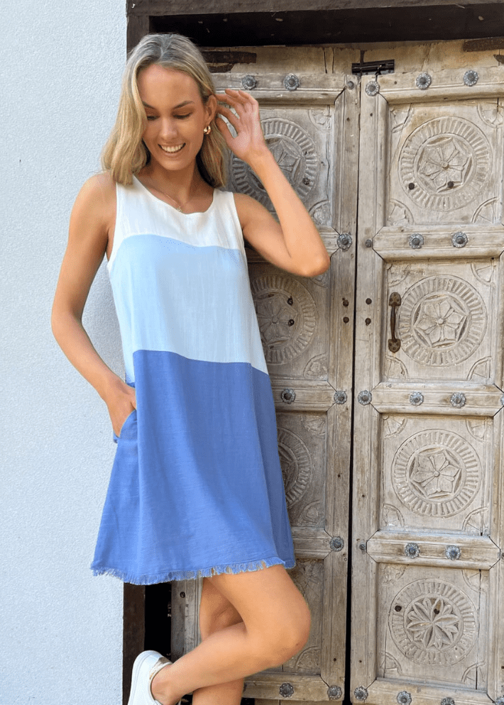 Women's Sleeveless A-line mini dress with a frayed hem and a color-block design in white, light blue, and navy