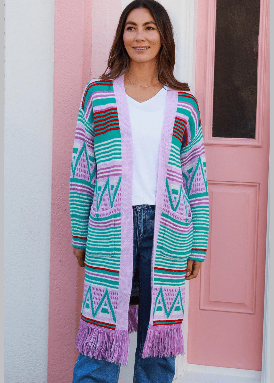 Women wearing a Geometric Knit Cardigan with Pastel Pink, Turquoise, and Red Aztec Patterns and Fringe Hem